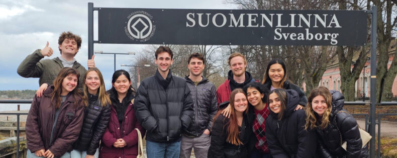 Students posing in front of the Sveaborg sign.