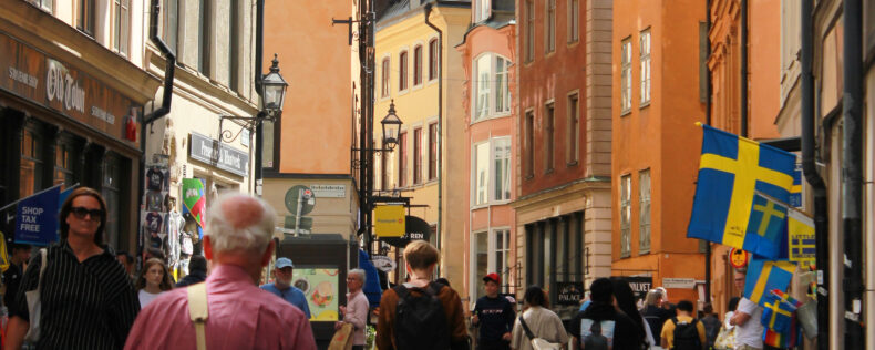 A busy street full of people in Gamla Stan, Stockholm.