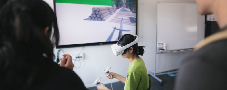 Student playing with a VR headset during the DIS Festival