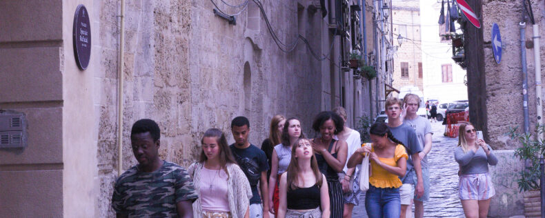Students being guided through Palermo during a tour