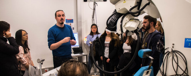 Professor explaining concepts during a neuroscience lab session.