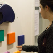 A student playing a wall game during a psychology class field study.