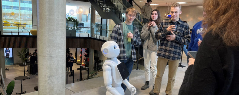 Students interacting with a robot.